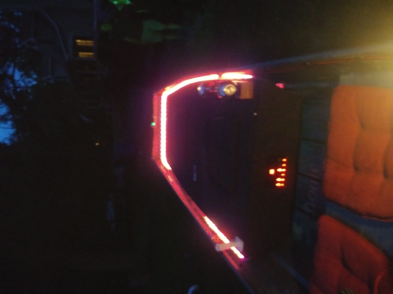 Close-up of red and white LED lighting glowing at night